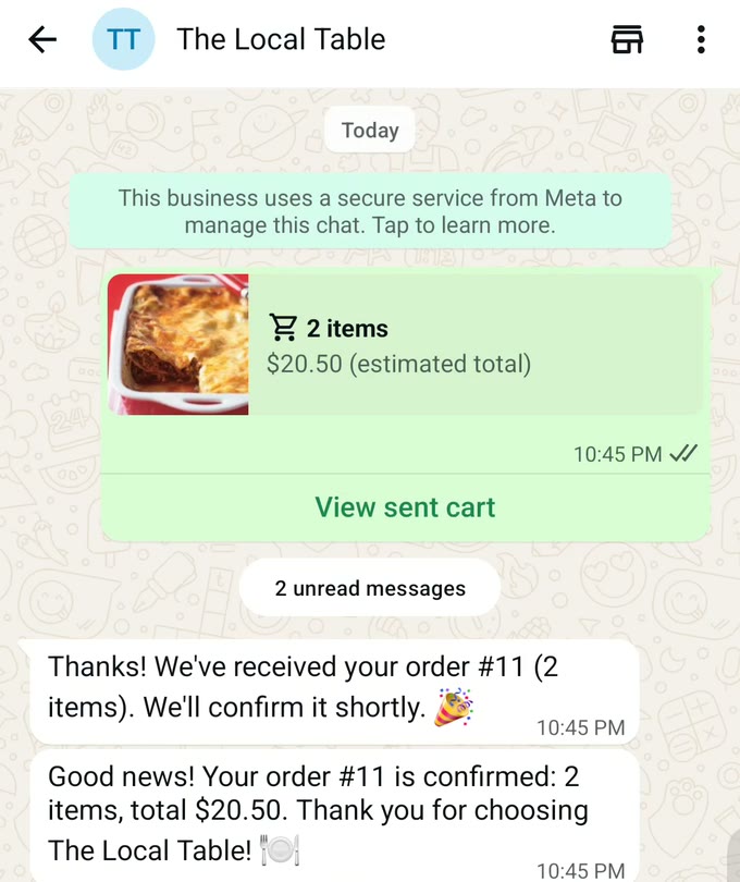 WhatsApp chat with The Local Table: a sent cart of 2 items at $20.50 (estimated total), then the reply "Thanks! We've received your order #11 (2 items). We'll confirm it shortly.", then "Good news! Your order #11 is confirmed: 2 items, total $20.50. Thank you for choosing The Local Table!"
